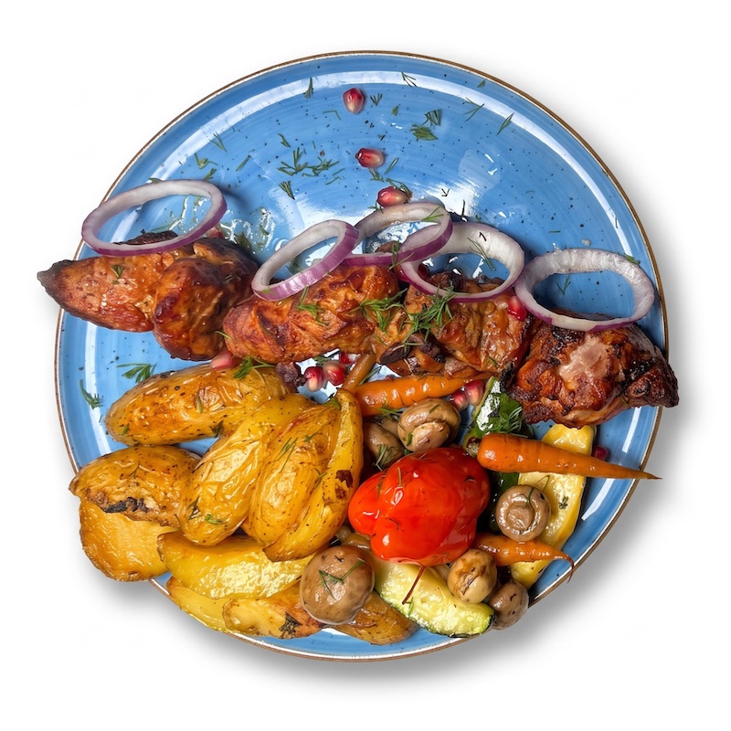 Mzwadi — pork skewer with potatoes and vegetables